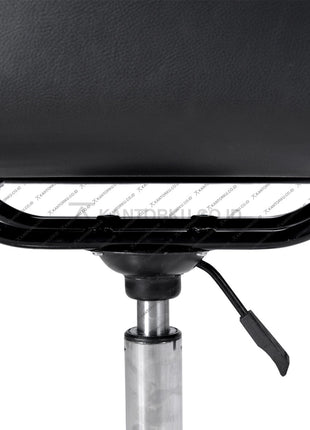 Close-up of a black leather chair with a metal base on a white background KANTORKU.co.id Solusi Tepat Kebutuhan Kantor Kamu!!